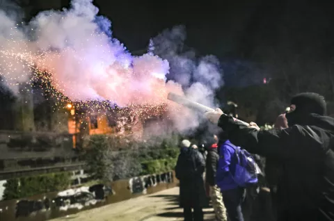 epa11761055 A supporter of the Georgian opposition launches fireworks during a protest in front of the Parliament building in Tbilisi, Georgia, 06 December 2024. Thousands of pro-EU activists continue their protests in the Georgian capital against the country's ruling party decision to suspend accession talks with the European Union (EU) until the end of 2028. EPA/DAVID MDZINARISHVILI