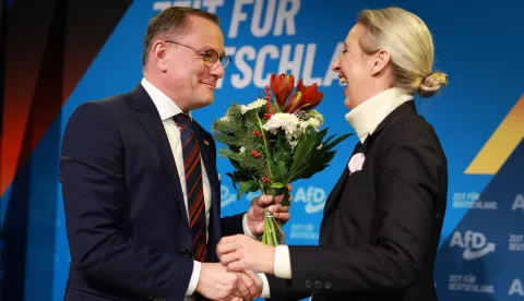 epa11761837 Alternative for Germany (AfD) party and faction co-chairwoman and top candidate for the federal election Alice Weidel (R) receives flowers from Alternative for Germany (AfD) party and faction co-chairman Tino Chrupalla (L), during a press conference of the Alternative for Germany (AfD) in Berlin, Germany, 07 December 2024. The Alternative for Germany (AfD) party held a press conference to present their Chancellor candidate ahead of the upcoming German federal election. EPA/CLEMENS BILAN