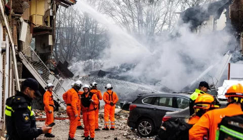 epa11761853 Rescuers work at the site of a partially collapsed building after a fire and an explosion, in The Hague, the Netherlands, 07 December 2024. A three-storey apartment building partially collapsed on 07 December, after an explosion and a fire. At least four people were transported to hospital, emergency services said. EPA/JEFFREY GROENEWEG