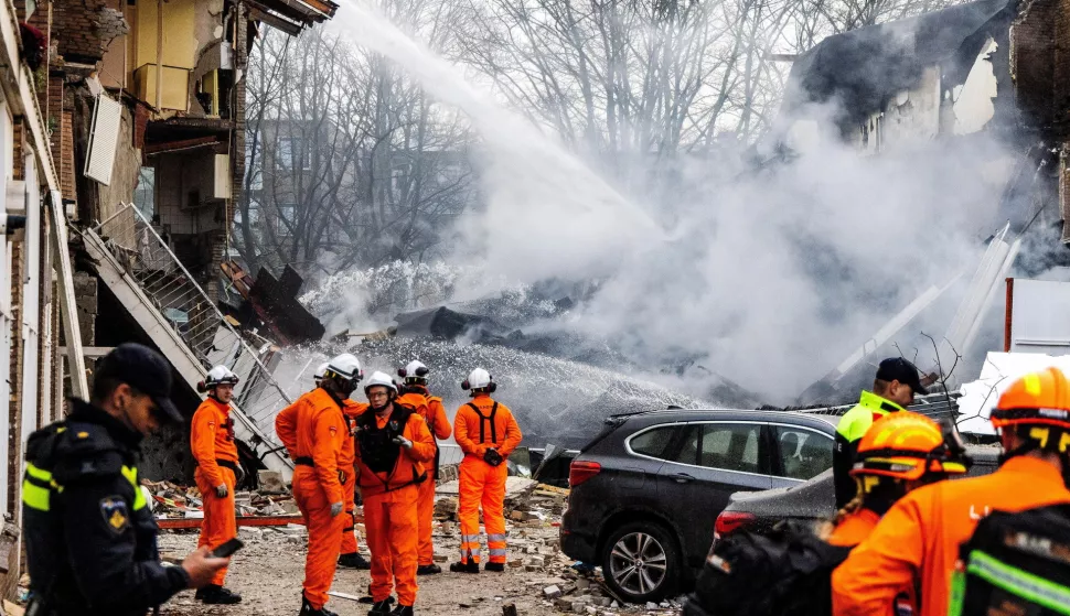 epa11761853 Rescuers work at the site of a partially collapsed building after a fire and an explosion, in The Hague, the Netherlands, 07 December 2024. A three-storey apartment building partially collapsed on 07 December, after an explosion and a fire. At least four people were transported to hospital, emergency services said. EPA/JEFFREY GROENEWEG