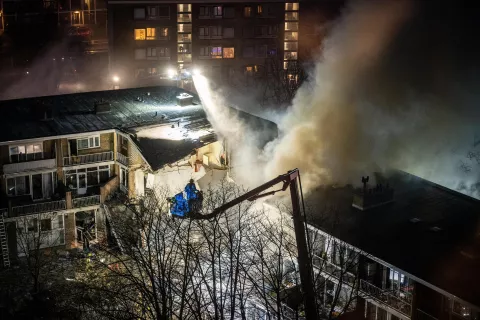 epa11761568 Emergency services try to extinguish a fire after a fire and an explosion at a residential building, in The Hague, the Netherlands, 07 December 2024. The explosion blew away several apartments. EPA/JOSH WALET