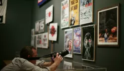 People Power: Fighting for Peace exhibition A photographer filming a photomontage entitled Photo Op, 2007 - depicting former Prime Minister Tony Blair taking a selfie in front of a huge explosion, by artists Peter Kennard and Cat Phillipps -during a press view of the People Power: Fighting for Peace exhibition at the Imperial War Museum in London. Yui Mok Photo: Press Association/PIXSELL