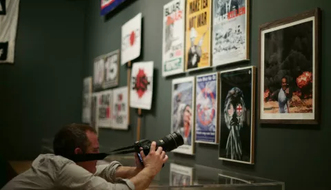 People Power: Fighting for Peace exhibition A photographer filming a photomontage entitled Photo Op, 2007 - depicting former Prime Minister Tony Blair taking a selfie in front of a huge explosion, by artists Peter Kennard and Cat Phillipps -during a press view of the People Power: Fighting for Peace exhibition at the Imperial War Museum in London. Yui Mok Photo: Press Association/PIXSELL