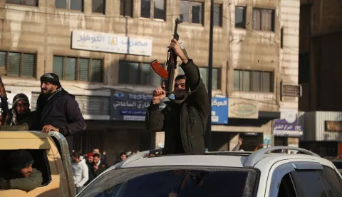 epa11765717 Syrian rebels celebrate following the takeover of Damascus, in Homs, Syria, 08 December 2024. Syrian rebels entered Damascus on 08 December 2024 and announced in a televised statement the 'Liberation of the city of Damascus and the overthrow of Bashar al-Assad', as well as the release of all the prisoners. The rebels also urged the Syrian armed forces to leave Syrian public institutions, which will stay under the control of the outgoing Syrian prime minister until the official handover ceremony. EPA/BILAL AL HAMMOUD