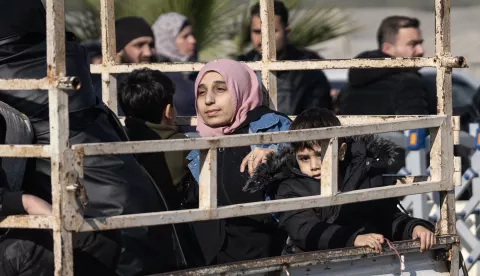 epa11766503 Syrians wait to cross into Syria from Turkey at the Cilvegozu Border Gate in Reyhanli district of Hatay, Turkey, 09 December 2024. On 09 December 2024, the Political Affairs Department of the Syrian Salvation government called for all refugees outside Syria to return. Syrian rebels entered Damascus on 08 December 2024 and announced in a televised statement the 'Liberation of the city of Damascus and the overthrow of Bashar al-Assad,' as well as the release of all the prisoners. The rebels also urged the Syrian armed forces to leave Syrian public institutions, which will stay under the control of the outgoing Syrian prime minister until the official handover ceremony. EPA/KAZIM KIZIL