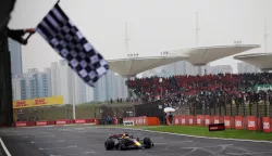 epa11291174 Red Bull Racing driver Max Verstappen of the Netherlands passes the chequered flag as he wins the Formula One Chinese Grand Prix, in Shanghai, China, 21 April 2024. The 2024 Formula 1 Chinese Grand Prix is held at the Shanghai International Circuit racetrack on 21 April after a five-year hiatus. EPA/ANDRES MARTINEZ CASARES/POOL