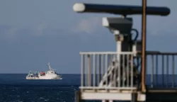 epa10105305 A marine vessel maneuver past a radar tower as it sails away from the location where the Chinese military believed to conduct a live fire drill, is seen from the coast of New Taipei city, Taiwan, 04 August 2022. After the visit of US house Speaker Nancy Pelosi in Taiwan, the Chinese military hold a series of live-fire drills in six maritime areas near Taiwan from 04 - 07 August 2022. EPA/RITCHIE B. TONGO