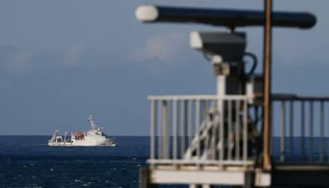 epa10105305 A marine vessel maneuver past a radar tower as it sails away from the location where the Chinese military believed to conduct a live fire drill, is seen from the coast of New Taipei city, Taiwan, 04 August 2022. After the visit of US house Speaker Nancy Pelosi in Taiwan, the Chinese military hold a series of live-fire drills in six maritime areas near Taiwan from 04 - 07 August 2022. EPA/RITCHIE B. TONGO