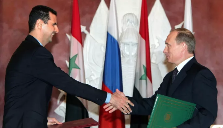 epa11765576 (FILE) - Syrian President Bashar al-Assad (L) and Russian President Vladimir Putin (R) shake hands as they exchange documents during a signing ceremony at the Kremlin in Moscow, Russia, 25 January 2025 (reissued 08 December 2024). According to Russia's state-owned news agency TASS quoting Kremlin sources, former Syrian President Bashar al-Assad arrived in Moscow with his family, after receiving 'asylum' in Russia. Syrian rebels entered Damascus on 08 December 2024 and announced in a televised statement the 'Liberation of the city of Damascus and the overthrow of Bashar al-Assad', as well as the release of all the prisoners. The rebels also urged the Syrian armed forces to leave Syrian public institutions, which will stay under the control of the outgoing Syrian prime minister until the official handover ceremony. EPA/SERGEI CHIRIKOV