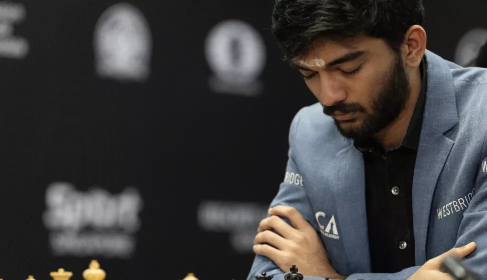 epa11771903 Chess grandmaster Gukesh Dommaraju of India competes in Game 14 against Ding Liren (not pictured) of China at the FIDE World Chess Championship in Singapore, 12 December 2024. EPA/HOW HWEE YOUNG