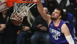 epa09652135 LA Clippers center Ivica Zubac scores against the San Antonio Spurs during the first quarter of the NBA basketball game between the Los Angeles Clippers and San Antonio Spurs at the Staples Center in Los Angeles, California, USA, 20 December 2021. EPA/CAROLINE BREHMAN SHUTTERSTOCK OUT