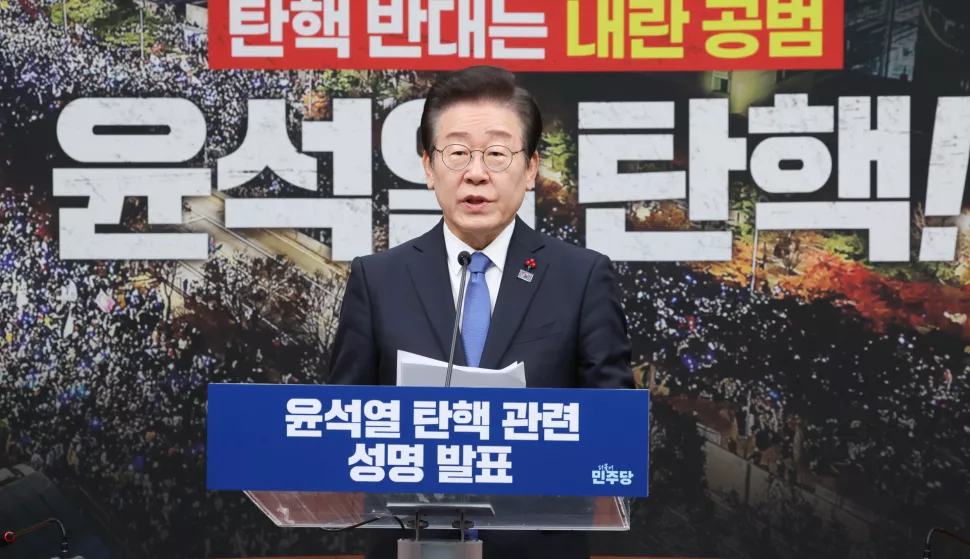 epa11773848 Lee Jae-myung, leader of the main opposition Democratic Party, delivers a statement calling on lawmakers to support a bill to impeach President Yoon Suk Yeol over his short-lived imposition of martial law at the National Assembly in Seoul, South Korea, 13 December 2024. EPA/YONHAP SOUTH KOREA OUT