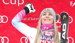 epa06393077 Lindsey Vonn of US celebrates on the podium after winning the Women's Super G race at the FIS Alpine Skiing World Cup in Val D'Isere, France, 16 December 2017. EPA/GUILLAUME HORCAJUELO