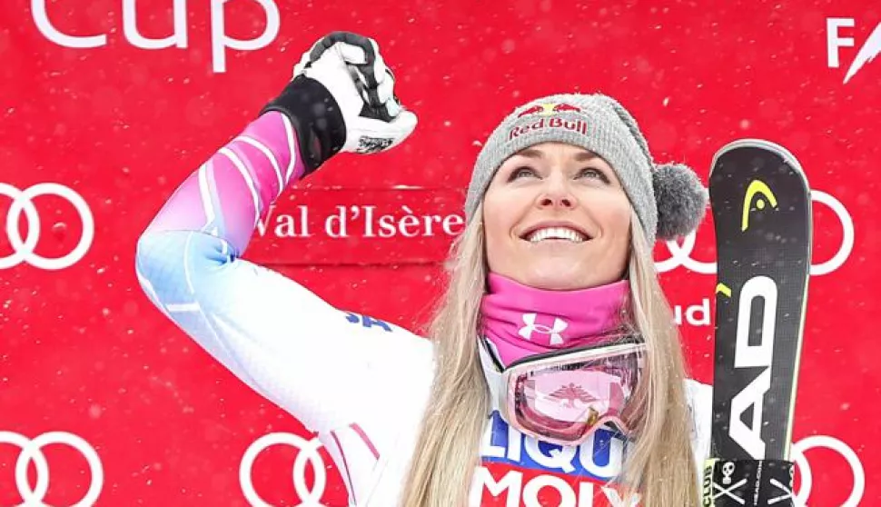 epa06393077 Lindsey Vonn of US celebrates on the podium after winning the Women's Super G race at the FIS Alpine Skiing World Cup in Val D'Isere, France, 16 December 2017. EPA/GUILLAUME HORCAJUELO