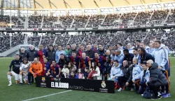 epa11778071 FC Barcelona Legends' Andres Iniesta (C) poses with his family and players after a friendly soccer match between FC Barcelona Legends and Real Madrid Legends at Ajinomoto Stadium, in Tokyo, Japan, 15 December 2024. EPA/FRANCK ROBICHON