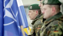 epa05776009 Soldiers partake in a welcoming ceremony for the first troops of the NATO enhanced Forward Presence (eFP) battalion group at the Rukla base in Rukla, Lithuania, 07 February 2017. NATO decided to station a multinational battalion in each of the three Baltic countries in response to Russia's intervention in Ukraine and military activity in the region. EPA/VALDA KALNINA