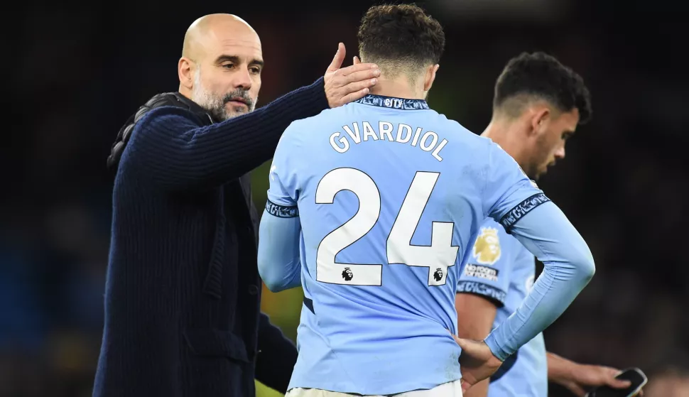 epa11779374 Manchester City's manager Pep Guardiola (L) and his player Josko Guardiol react after losing the English Premier League soccer match between Manchester City and Manchester United, in Manchester, Britain, 15 December 2024. EPA/PETER POWELL