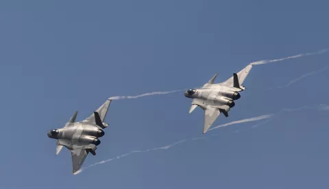 epa07144126 Two Chinese J-20 'Chengdu' stealth fighter jets perform during a flying display on the first day of a military airshow in Zhuhai, Guangzhou province, China, 06 November 2018. The China International Aviation and Aerospace Exhibition, China's largest international aerospace trade show, runs until 11 November 2018. EPA/ALEKSANDAR PLAVEVSKI