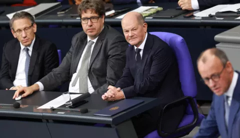 epa11718521 German Chancellor Olaf Scholz (3-L), German Finance Minister Joerg Kukies (L) and Parliamentary State Secretary at the Ministry for Economy and Climate Michael Kellner (2-L) listen to the speech of Chairman of the Christian Democratic Union (CDU) party and faction Friedrich Merz during a session at the German Parliament Bundestag in Berlin, Germany, 13 November 2024. German Chancellor Scholz delivered a government statement on the current political situation EPA/CLEMENS BILAN