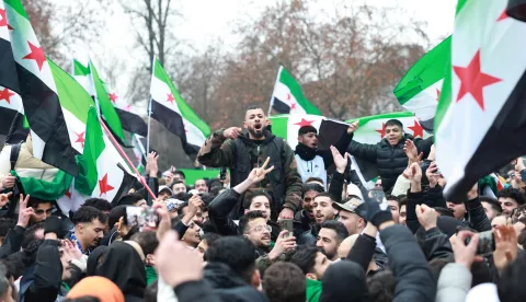 epa11764571 Supporters of the Syrian opposition residing in Germany celebrate the rebel take over of Damascus, in Berlin, Germany, 08 December 2024. Syrian rebels entered Damascus on 08 December 2024 and announced in a televised statement the 'Liberation of the city of Damascus and the overthrow of Bashar al-Assad,' as well as the release of all the prisoners. The rebels also urged the Syrian armed forces to leave Syrian public institutions, which will stay under the control of the outgoing Syrian prime minister until the official handover ceremony. EPA/CLEMENS BILAN