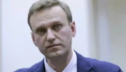 epa06480963 (FILE) - Russian opposition leader Alexei Navalny smiles as he attends a procedure to submit documents for his registration as a candidate for Russian presidency at the Russian Central Election Commission (CEC) headquarters in Moscow, Russia, 24 December 2017 (reissued 28 January 2018). Russian police wrestled Alexei Navalny into a patrol wagon on Sunday, after he appeared at a rally to urge voters to boycott what he said would be a rigged presidential election in March, media reports. EPA/MAXIM SHIPENKOV