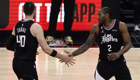 epa10560977 LA Clippers center Ivica Zubac (L) interacts with LA Clippers forward Kawhi Leonard after he scored during the first quarter of the game between the Los Angeles Clippers and the Los Angeles Lakers at Crypto.com Arena in Los Angeles, California, USA, 05 April 2023. EPA/ETIENNE LAURENT SHUTTERSTOCK OUT