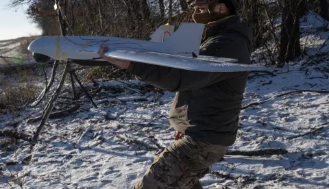 epa11777721 A Ukrainian serviceman of the 12th Special Operations Brigade 'Azov' prepares to launch a Ukrainian 'Furia' unmanned aerial system (UAS) to conduct aerial reconnaissance mission at an undisclosed location near the frontline city of Toretsk, Donetsk region, eastern Ukraine, 14 December 2024, amid the Russian invasion. EPA/MARIA SENOVILLA