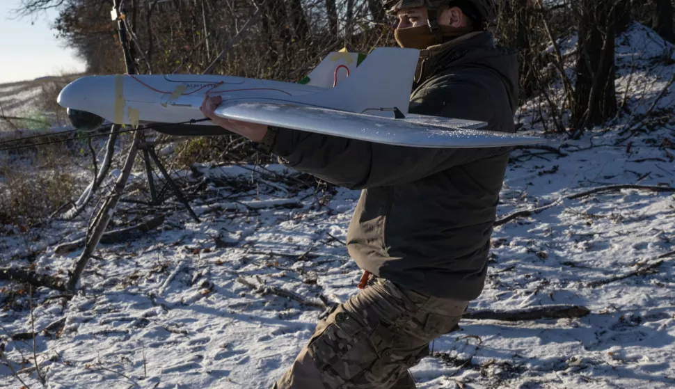 epa11777721 A Ukrainian serviceman of the 12th Special Operations Brigade 'Azov' prepares to launch a Ukrainian 'Furia' unmanned aerial system (UAS) to conduct aerial reconnaissance mission at an undisclosed location near the frontline city of Toretsk, Donetsk region, eastern Ukraine, 14 December 2024, amid the Russian invasion. EPA/MARIA SENOVILLA