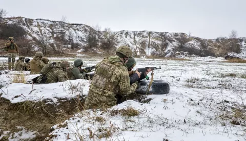 epa11762179 Ukrainian civilians take part in a military training on a shooting range in the Kharkiv region, Ukraine, 07 December 2024, amid the ongoing Russian invasion. The training, organized by the National Resistance Training Center, provides civilians with basic weapons, tactics and first-aid knowledge in the eventuality of having to defend their homes. Over 600 civilians completed the training in 2024 with around 300 others currently enrolled. EPA/SERGEY KOZLOV