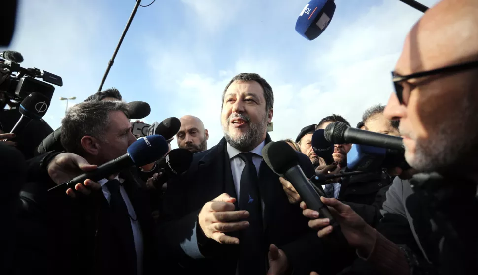 epa11786702 Italian Deputy Prime Minister Matteo Salvini (C) speaks to journalists as he arrives at the bunker courtroom of the Pagliarelli prison for the verdict in his trial, in Palermo, Sicily, Italy, 20 December 2024. Prosecutors in the Sicilian city have requested a six-year jail term for Salvini on charges of abduction and refusal to perform public acts for not allowing the disembarkation of 147 migrants rescued by the Spanish NGO Open Arms vessel for 19 days in August 2019 when he was interior minister. EPA/IGOR PETYX