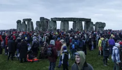 epa11788193 Revellers take part in the winter solstice celebrations at the ancient Stonehenge monument in Wiltshire, Britain, 21 December 2024. The winter solstice, also known as midwinter, marks the day with the shortest period of daylight and the longest night of the year in the northern hemisphere.  EPA/TOLGA AKMEN