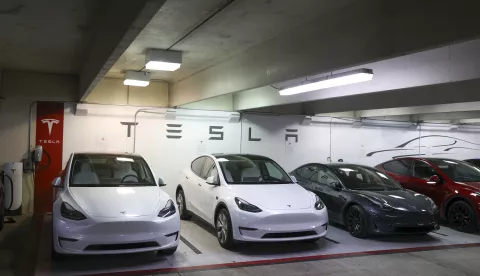 epa11027240 Tesla cars are lined up at a showroom charging station in Austin, Texas, USA, 13 December 2023. Tesla has recalled the majority of their cars in the United States to fix the system that monitors the drivers using Autopilot. EPA/ADAM DAVIS