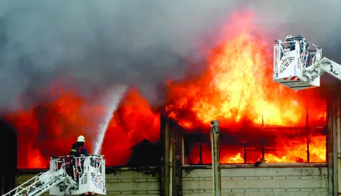 epa05642099 Fire fighters try to extinguish fire at a factory in Istanbul, Turkey 22 November 2016. A fire started at a plastic factory in the Bayrampasa district in the morning and no casualties were reported according to local media. EPA/SEDAT SUNA