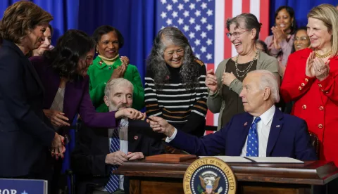 epa11781367 US President Joe Biden (2-R) gifts a pen to Acting Secretary of Labor Julie Su (2-L) after signing a proclamation establishing a national monument honoring the late FDR-era Labor Secretary Frances Perkins during an event on the American workforce at the Department of Labor in Washington, DC, USA, 16 December 2024. President Biden signed a proclamation establishing the Frances Perkins National Monument in Newcastle, Maine, to honor the historic contributions of America's first woman Cabinet Secretary and the longest-serving Secretary of Labor. EPA/SAMUEL CORUM/POOL