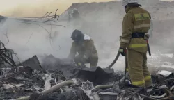 epa11792900 A handout photo made available by the press service of the Ministry for Emergency Situations of Kazakhstan shows emergency specialists working at the crash site of a passenger plane near Aktau, Kazakhstan, 25 December 2024. Azerbaijan Airlines Embraer ERJ-190AR passenger plane flying from Baku to Grozny crashed some three kilometres away from the city of Aktau. According to preliminary information, the incident was caused by a collision between the aircraft and a flock of birds. EPA/KAZAKHSTAN EMERGENCIES MINISTRY HANDOUT -- BEST QUALITY AVAILABLE -- MANDATORY CREDIT -- HANDOUT EDITORIAL USE ONLY/NO SALES