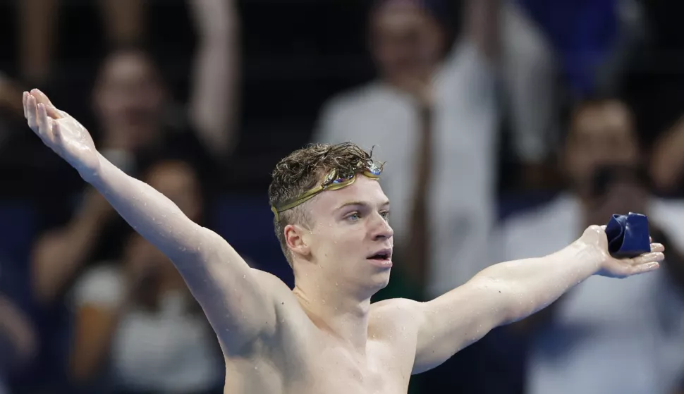 epa11520345 Leon Marchand of France celebrates winning the Men 200m Individual Medley final of the Swimming competitions in the Paris 2024 Olympic Games, at the Paris La Defense Arena in Paris, France, 02 August 2024. EPA/MAST IRHAM