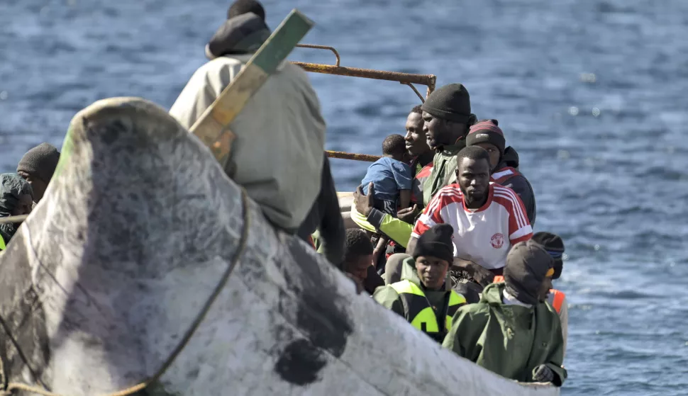 epa11793248 A group of 75 migrants arrive towed by 'Salvamar Adhara' rescue ship at La Restinga dock in El Pinar, El Hierro, Canary Islands, Spain, 25 December 2024. A total of 184 immigrants were rescued from three 'cayucos' in the waters of the Canary Islands on Christmas Day; the first reached El Hierro with 80 sub-Saharan immigrants on board, another arrived at Arguineguin with 64 migrants, and a third reached Tenerife, carrying 40 individuals, including women and minors. EPA/GELMERT FINOL
