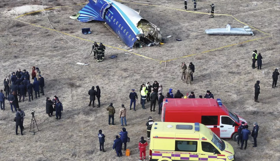 epaselect epa11792889 Emergency specialists work at the crash site of a passenger plane near Aktau, Kazakhstan, 25 December 2024. Azerbaijan Airlines Embraer ERJ-190AR passenger plane flying from Baku to Grozny crashed some three kilometres away from the city of Aktau. According to preliminary information, the incident was caused by a collision between the aircraft and a flock of birds. EPA/AZAMAT SARSENBAYEV