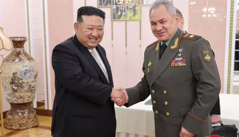 epa10770768 A photo released by the official North Korean Central News Agency (KCNA) shows North Korean Supreme Leader Kim Jong-un (L) shaking hands with Minister of Defense of the Russian Federation Sergei Shoigu (R) during a meeting at the office building of the Party Central Committee in Pyongyang, North Korea, 26 July 2023 (issued 27 July 2023). Shoigu is on a visit to North Korea coinciding with the nation's celebration of the armistice that ceased direct conflict in the 1950-53 Korean War. EPA/KCNA  EDITORIAL USE ONLY