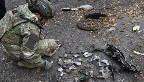 epa11739476 Ukrainian experts inspect debris at the site of a missile strike that hit central Kharkiv, northeastern Ukraine, 25 November 2024, amid the Russian invasion. At least 23 people were injured as a result of a missile strike that hit Kharkiv on 25 November morning, the State Emergency Service of Ukraine (SESU) reported. Russian troops launched 145 'shock' drones across Ukraine overnight and several ballistic missiles to Odesa and Kharkiv in the morning, according to the Air Force Command of Ukraine. Russian troops entered Ukrainian territory on 24 February 2022, starting a conflict that has provoked destruction and a humanitarian crisis. EPA/SERGEY KOZLOV