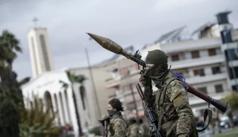 epa11794983 Syrian opposition fighters march during a military parade in Damascus, Syria, 27 December 2024. Members of Hay'at Tahrir al-Sham (HTS) began marching from abbasieen Square, passing through some of the Damascene neighborhoods, and arrived at Umayyad Square in a parade organized to send a message of strength and reassurance to the people, according to HTS.