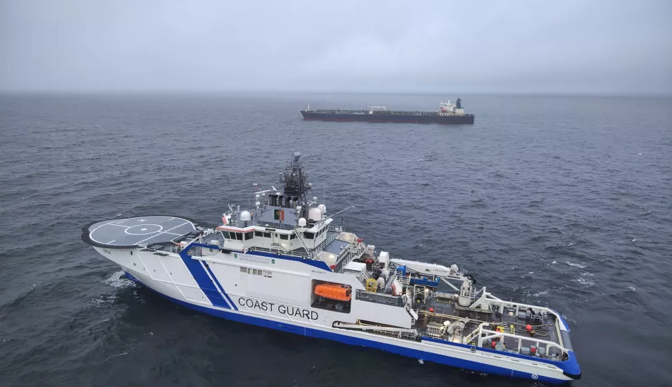 epa11795031 A handout photo dated made available by the Finnish Border Guard on 27 December 2024 shows a border guard vessel and tanker Eagle S off Porkkalanniemi peninsula, Finland, 27 December 2024. Finnish authorities are investigating the Eagle S, an oil tanker registered with the Cook Islands, suspected of having caused the outage of an undersea power cable connecting Finland and Estonia on 25 December. EPA/HANDOUT HANDOUT EDITORIAL USE ONLY/NO SALES