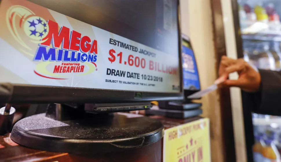 epa07112065 A customer checks their previous draw tickets before purchasing Mega Millions lottery tickets at a retailer in Washington, DC, USA, 22 October 2018. No winning tickets were sold for Friday's Mega Millions drawing, a 44-state lottery, and the jackpot now grows to 1.6 billion US dollars for the next drawing on 23 October 2018. EPA/ERIK S. LESSER