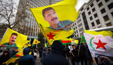 epa11770329 Kurds wave flags and pictures of Kurdistan Workers' Party leader Abdullah Ocalan during a protest called by the Democratic Council of Kurdistan Communities in Belgium (NAV-BEL), near the European Parliament in Brussels, Belgium, 11 December 2024. NAV-BEL called for the protest against the role of Turkey in Syria and to highlight the need for protecting the Kurds in that country, following the overthrow of president Bashar al-Assad. EPA/OLIVIER MATTHYS