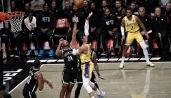 epa10440638 Los Angeles Lakers guard Russell Westbrook (C) shoots over Brooklyn Nets forward Cam Thomas (L) during the first half of the NBA basketball game between the Los Angeles Lakers and the Brooklyn Nets at Barclays Center in Brooklyn, New York, USA, 30 January 2023. EPA/Peter Foley SHUTTERSTOCK OUT