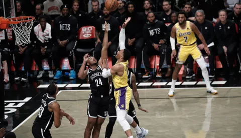 epa10440638 Los Angeles Lakers guard Russell Westbrook (C) shoots over Brooklyn Nets forward Cam Thomas (L) during the first half of the NBA basketball game between the Los Angeles Lakers and the Brooklyn Nets at Barclays Center in Brooklyn, New York, USA, 30 January 2023. EPA/Peter Foley SHUTTERSTOCK OUT