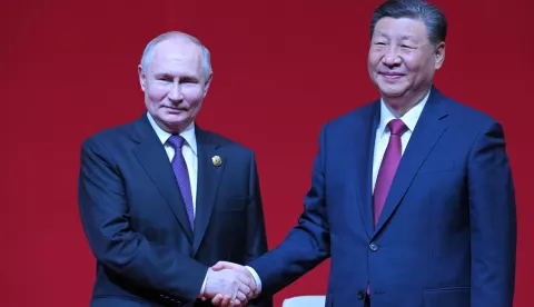 epa11344769 Russian President Vladimir Putin (L) and Chinese President Xi Jinping shake hands during a concert marking the 75th anniversary of the establishment of diplomatic relations between Russia and China and the opening of the China-Russia Years of Culture at the National Centre for the Performing Arts in Beijing, China, 16 May 2024. The Russian president is on an official visit to China on 16 and 17 May. EPA/SERGEY GUNEEV/SPUTNIK/KREMLIN POOL MANDATORY CREDIT