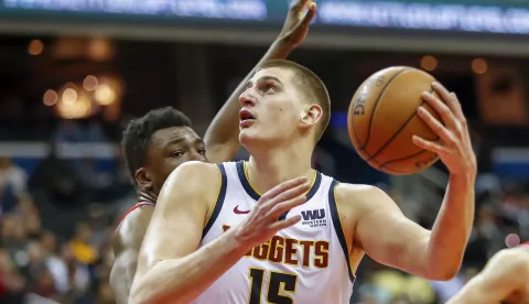 epa08505950 (FILE) - Denver Nuggets center Nikola Jokic (R) in action against Washington Wizards center Thomas Bryant (L) during the NBA basketball game between the Denver Nuggets and the Washington Wizards in Washington, DC, USA, 21 March 2019 (re-issued on 24 June 2020). Serbian basketball player Nikola Jokic of the Denver Nuggets was tested positive for the coronavirus COVID-19 disease, the Denver Post confirmed on late 23 June 2020. Jokic met Serbian tennis player Novak Djokovic during the Adria Tour tennis tournament in Belgrade. EPA/ERIK S. LESSER SHUTTERSTOCK OUT