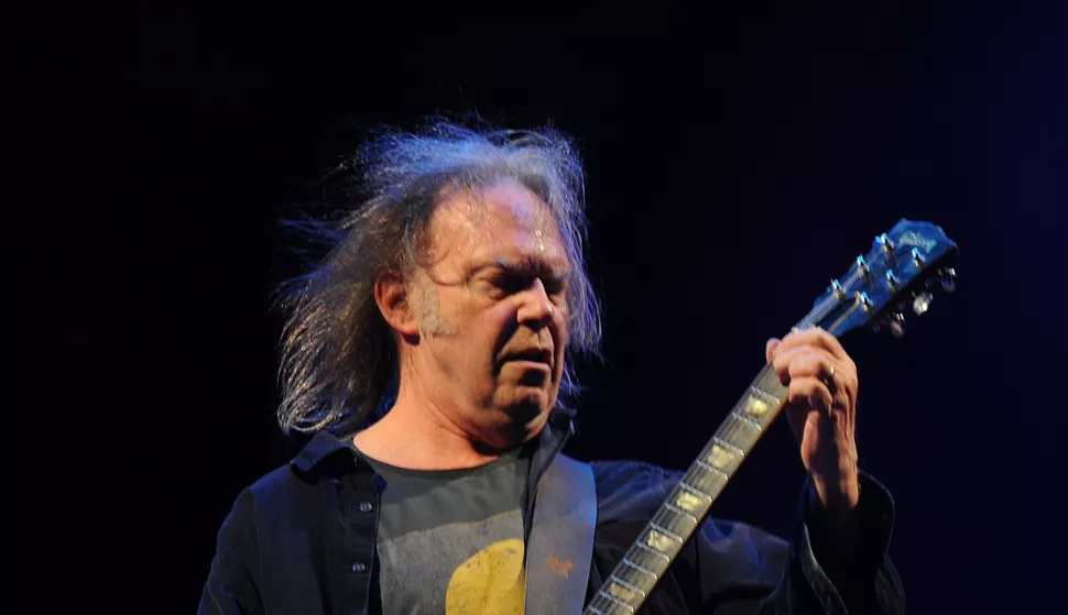 File photo dated 26/06/09 of Neil Young performing on the Pyramid Stage during the 2009 Glastonbury Festival at Worthy Farm in Pilton, Somerset. The Canadian-born singer-songwriter, 79, has announced he will not be playing at Glastonbury Festival this year as he believes the music event is "now under corporate control" of the BBC. Issue date: Thursday January 2, 2025. Photo: Anthony Devlin/PRESS ASSOCIATION