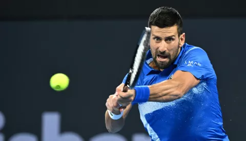 epa11802010 Novak Djokovic of Serbia in action against Gael Monfils of France during their Brisbane International tennis tournament match at Queensland Tennis Centre in Brisbane, Australia, 02 January 2025. EPA/DARREN ENGLAND AUSTRALIA AND NEW ZEALAND OUT